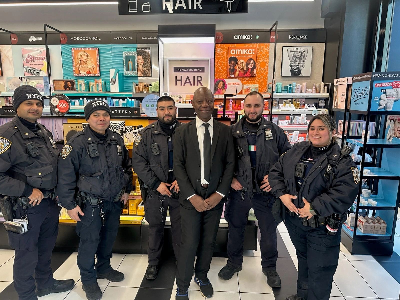 On Demand officers with a client at a Harlem retail store